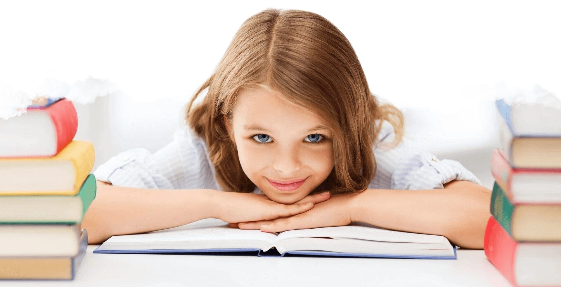 A girl is laying on the floor reading